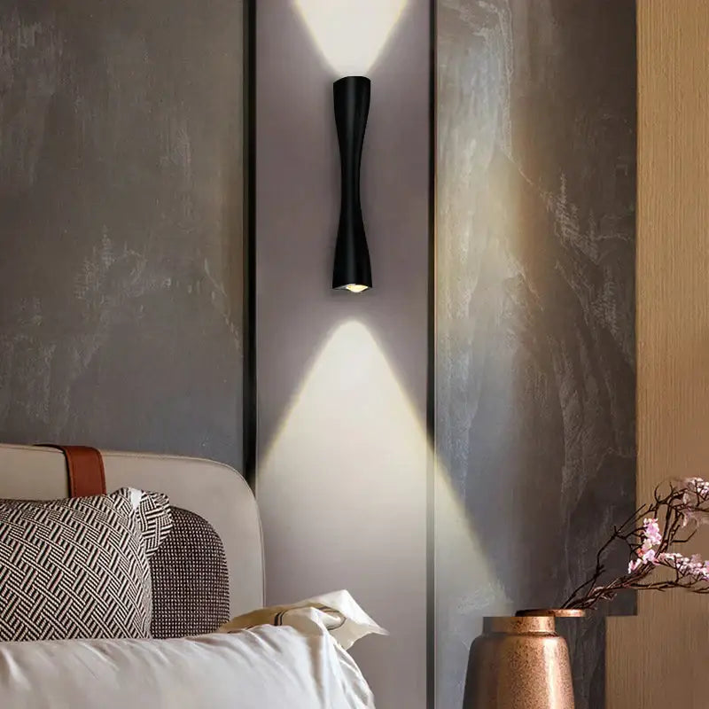 Black curved IP65 outdoor wall sconce, matte metal finish with upward and downward light on Tampa Home & Garden Store