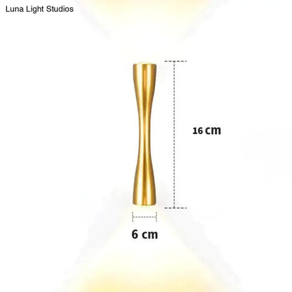 Black curved IP65 outdoor wall sconce with gold twist design, 16 cm tall, 6 cm wide on Tampa Home & Garden Store