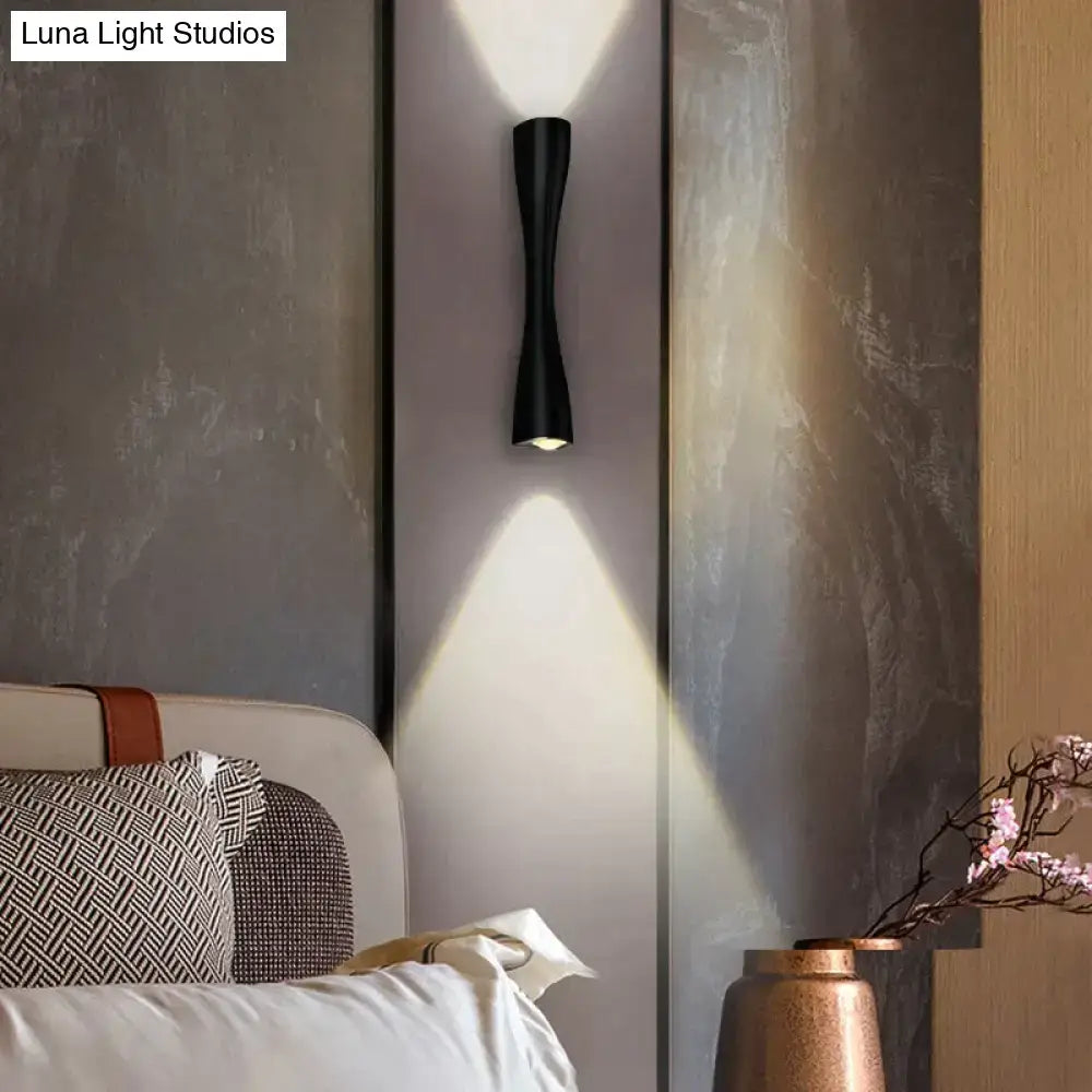 Black curved IP65 outdoor wall sconce by Decorbites, wall-mounted with dual up and down lighting on Tampa Home & Garden Store