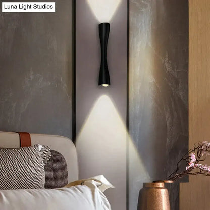 Black curved IP65 outdoor wall sconce by Decorbites, wall-mounted with dual up and down lighting on Tampa Home & Garden Store