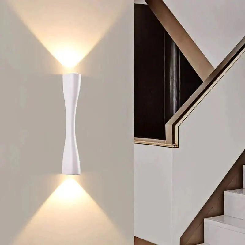 Black curved IP65 outdoor wall sconce with dual uplight and downlight by Decorbites on Tampa Home & Garden Store