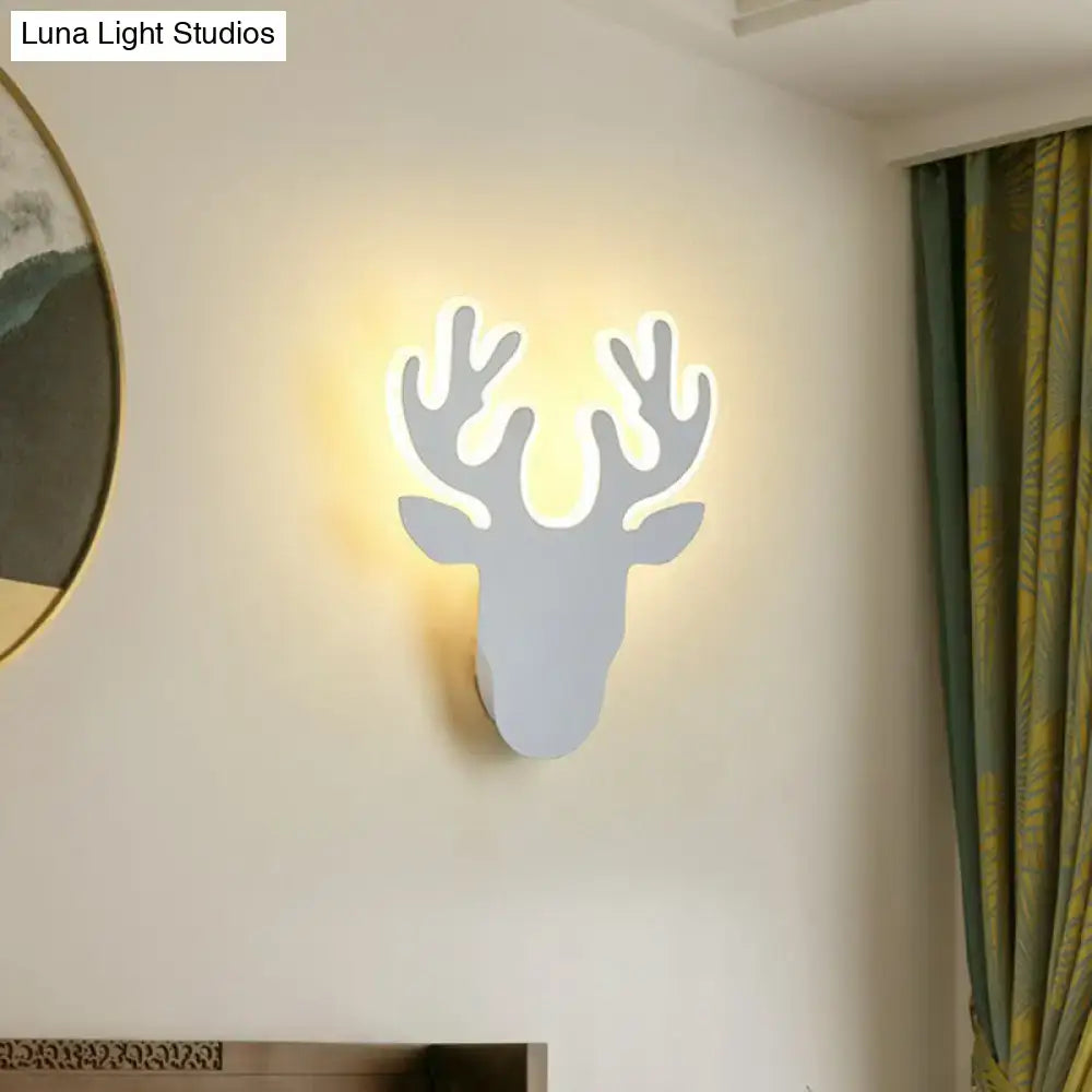Deer head wall sconce with backlit antlers in white finish on Tampa Home & Garden Store