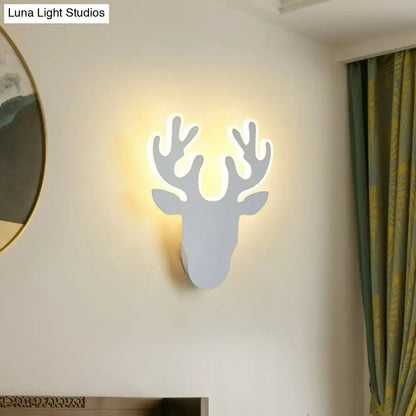 Deer head wall sconce with backlit antlers in white finish on Tampa Home & Garden Store