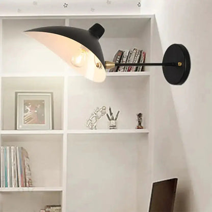 Modern black duckbill shade wall lamp by Decorbites with curved arm and brass accent on Tampa Home & Garden Store