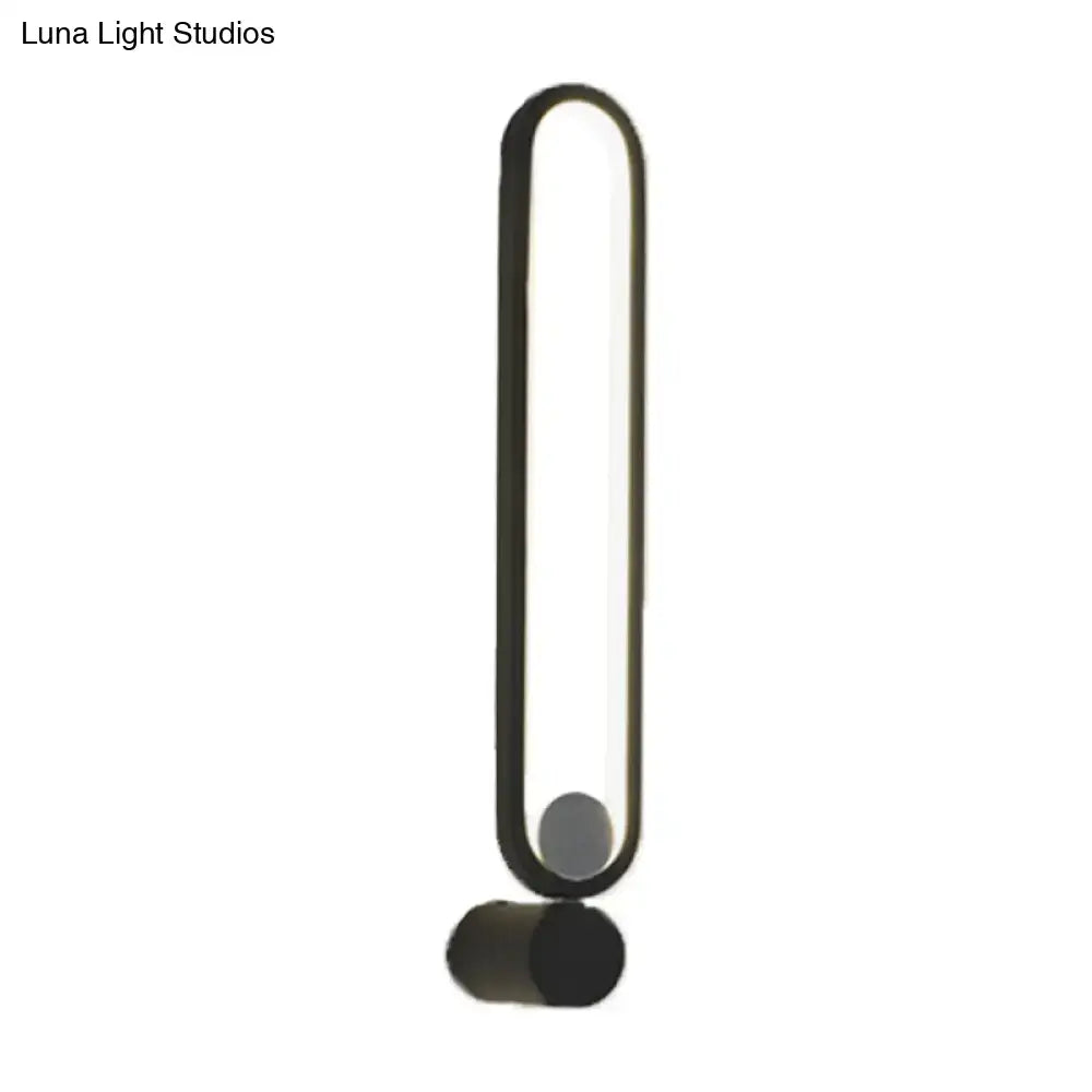 Black elliptical LED sconce wall light with vertical rounded panel by Decorbites on Tampa Home & Garden Store