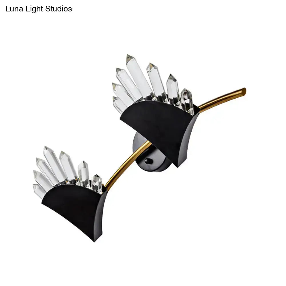 Modern black double wall sconce with crystal prisms and gold rod accents on Tampa Home & Garden Store