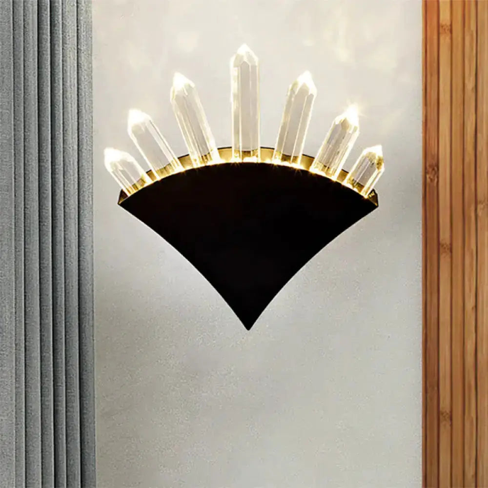 Modern black wall sconce with crystal prisms fanning upward, bedroom lighting on Tampa Home & Garden Store