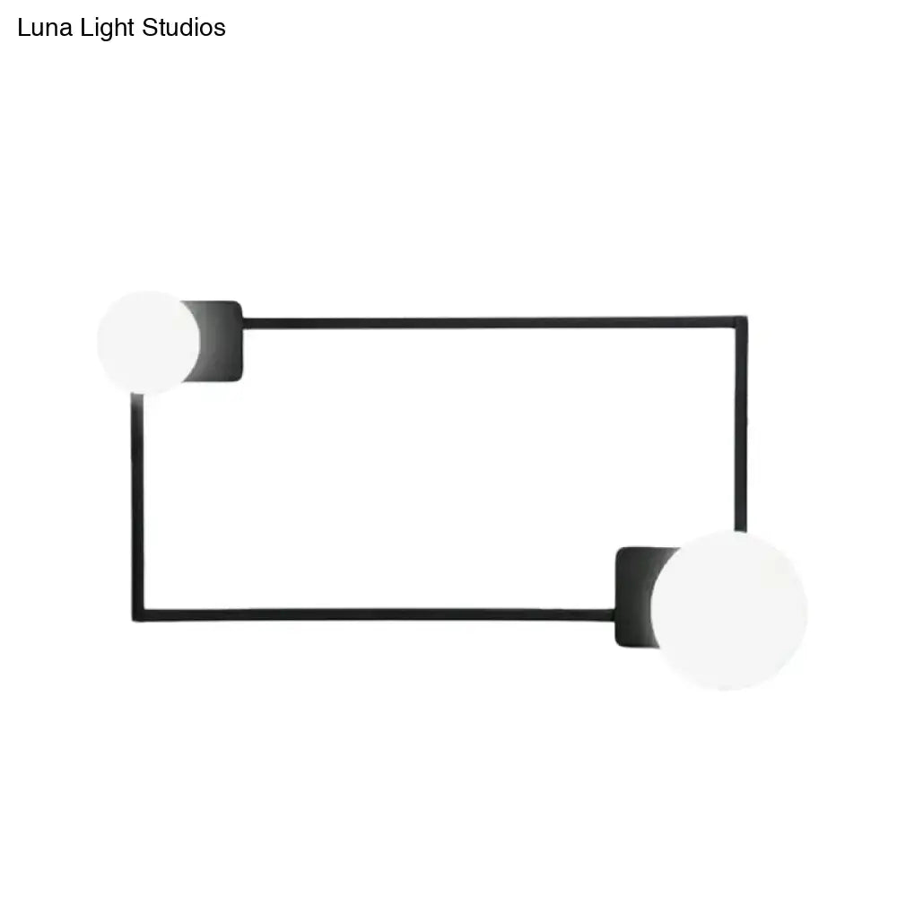Black rectangle glass globe sconce by Decorbites with two white globes on metal frame on Tampa Home & Garden Store