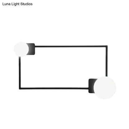 Black rectangle glass globe sconce by Decorbites with two white globes on metal frame on Tampa Home & Garden Store