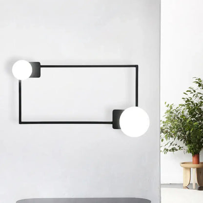 Black Rectangle Glass Globe Sconce by Decorbites with two white globes on black metal frame on Tampa Home & Garden Store