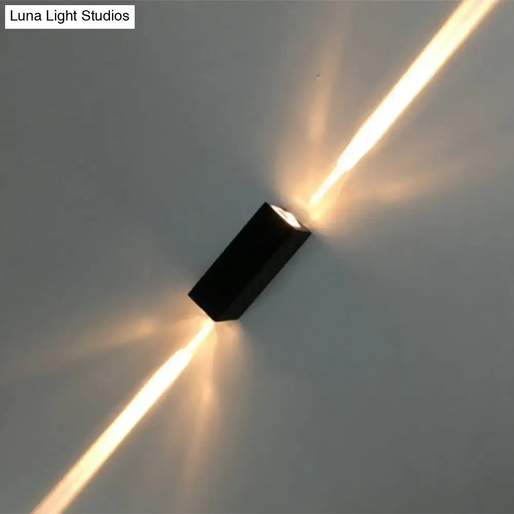 Black dual beam wall lamp sconce with two warm beams crossing the wall Decorbites on Tampa Home & Garden Store