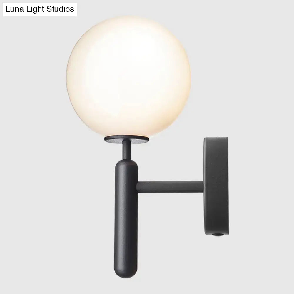 Black Glass Globe Lamp wall sconce with matte black finish and white glass globe by Decorbites on Tampa Home & Garden Store