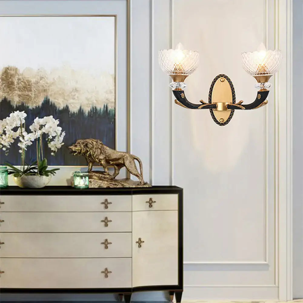 Black Gold Branch Sconce with two crystal glass shades, ornate black arms, gold backplate on Tampa Home & Garden Store