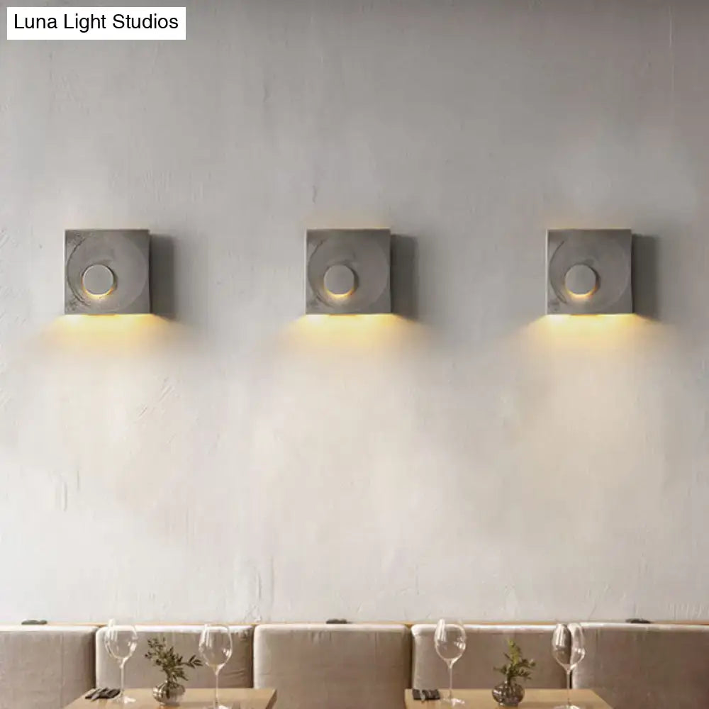Cement Nordic Wall Sconce trio; cement square with circular center, downlight over dining area on Tampa Home & Garden Store