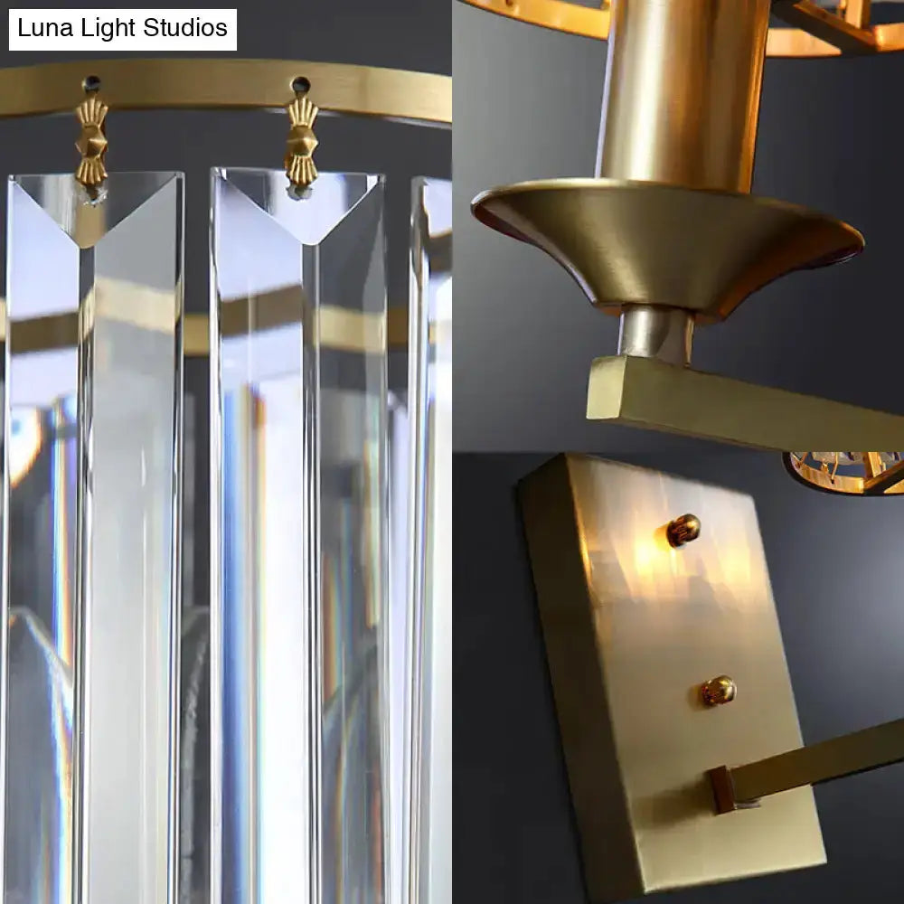 Modern black & gold crystal sconce light fixture with hanging prisms and brass accents on Tampa Home & Garden Store