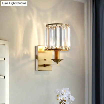 Modern black and gold crystal wall sconce with clear shade and brass base on Tampa Home & Garden Store