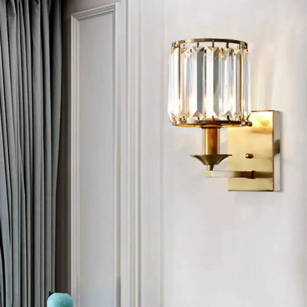 Crystal sconce wall light by Decorbites in gold finish with clear prisms on Tampa Home & Garden Store