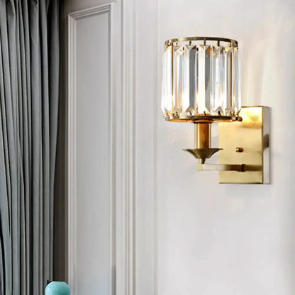 Crystal sconce wall light by Decorbites in gold finish with clear prisms on Tampa Home & Garden Store