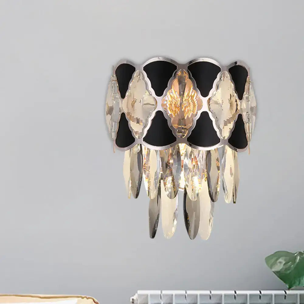 Black Gold Oval Wall Lamp with black and gold metal frame and hanging crystal prisms on Tampa Home & Garden Store