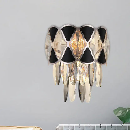 Black Gold Oval Wall Lamp with black and gold metal frame and hanging crystal prisms on Tampa Home & Garden Store