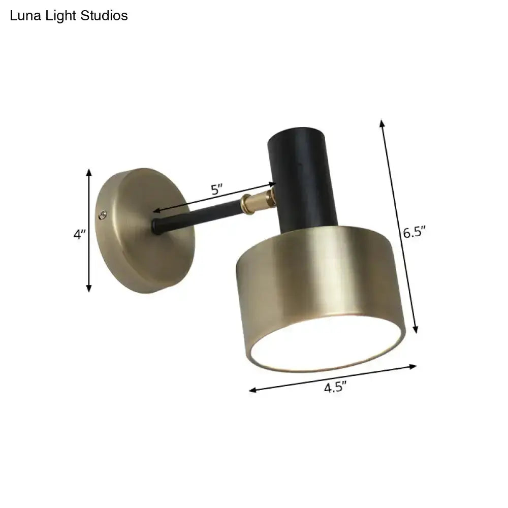 Modern black and gold metal cylinder sconce wall light with brass shade on Tampa Home & Garden Store