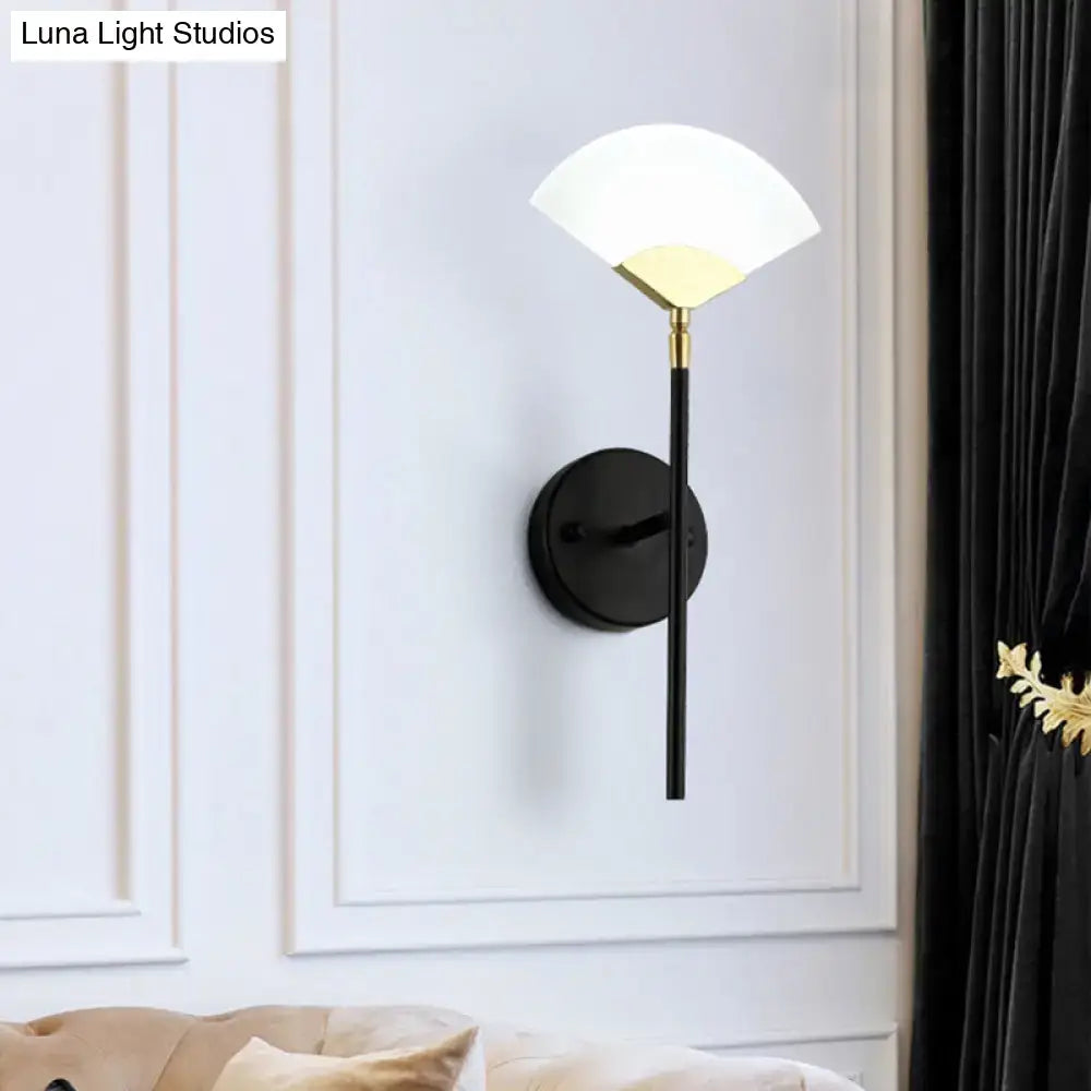 Black Gold Fan Sconce by Decorbites with black metal stem and white glass fan shade on wall on Tampa Home & Garden Store