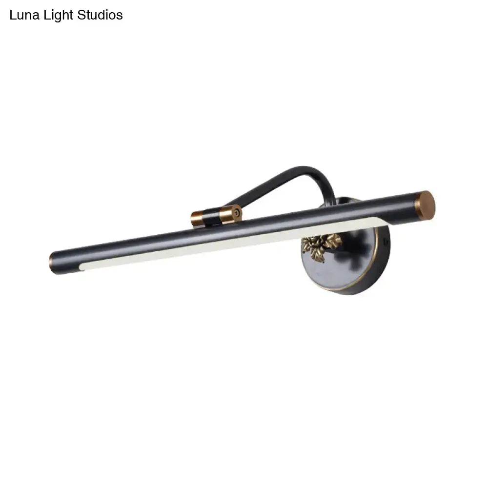 Black brass vanity sconce with cylindrical LED bar and gold accents, wall-mount fixture on Tampa Home & Garden Store