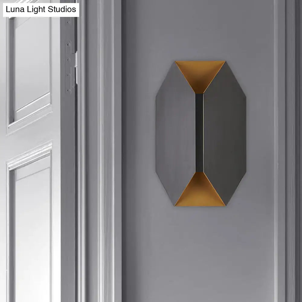 Black metal geometric wall lamp with gold interior accents by Decorbites on gray wall on Tampa Home & Garden Store