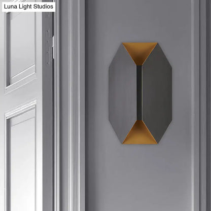 Black metal geometric wall lamp with gold interior accents by Decorbites on gray wall on Tampa Home & Garden Store