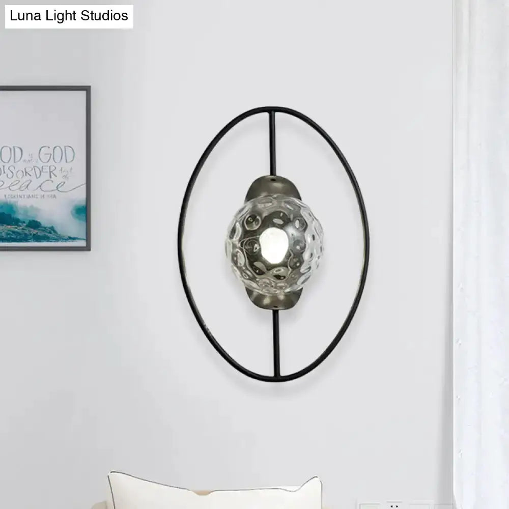 Modern black and gold glass orb wall lamp with oval metal frame by Decorbites for bedroom on Tampa Home & Garden Store