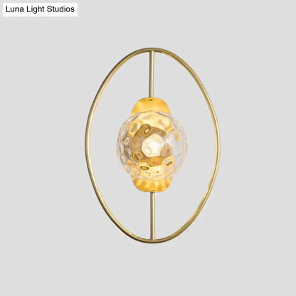 Modern gold glass orb wall lamp with circular brass ring and hammered glass orb bulb Decorbites on Tampa Home & Garden Store