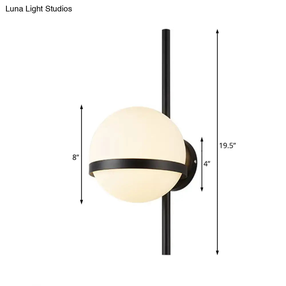 Black Gold Glass Sconce by Decorbites, frosted glass globe with black metal band and vertical mount on Tampa Home & Garden Store