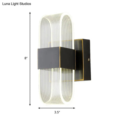 Black oval LED wall sconce with clear ribbed glass by Decorbites, 1-2 light on Tampa Home & Garden Store