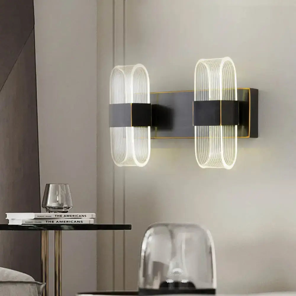 Decorbites black oval LED wall sconce 1-2 light with ribbed glass shields on dark metal mount on Tampa Home & Garden Store