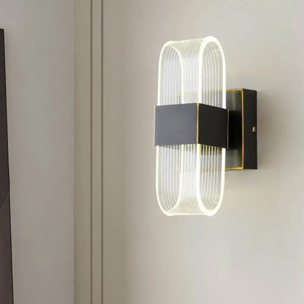 Black oval LED wall sconce with ribbed white acrylic loop and square mount, 1-2 light on Tampa Home & Garden Store