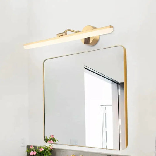 Decorbites modern black & gold LED wall light with gold bar and mount above a gold mirror on Tampa Home & Garden Store