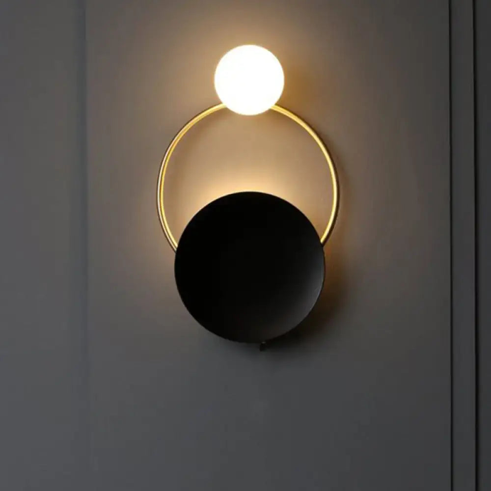 Black Planet Wall Sconce with gold circular ring and white globe light on Tampa Home & Garden Store