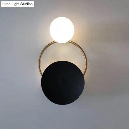 Decorbites Black Planet Wall Sconce with black disc, white globe, brass ring on Tampa Home & Garden Store