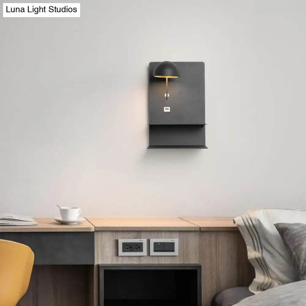 Black Gold USB Wall Light Decorbites mounted on a gray wall above a wooden desk on Tampa Home & Garden Store