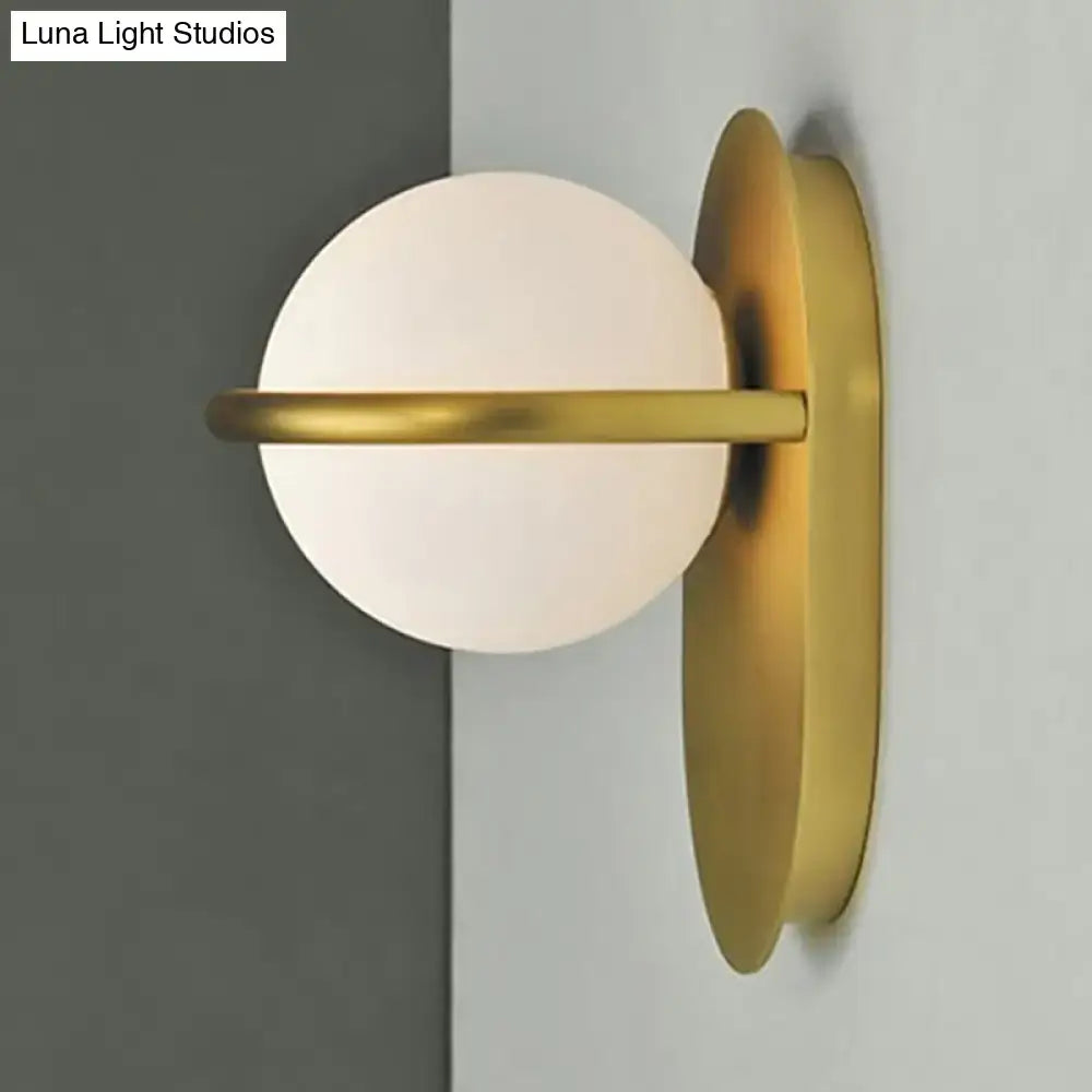Black Gold Milk Glass Wall Light with white globe and brass backplate on Tampa Home & Garden Store