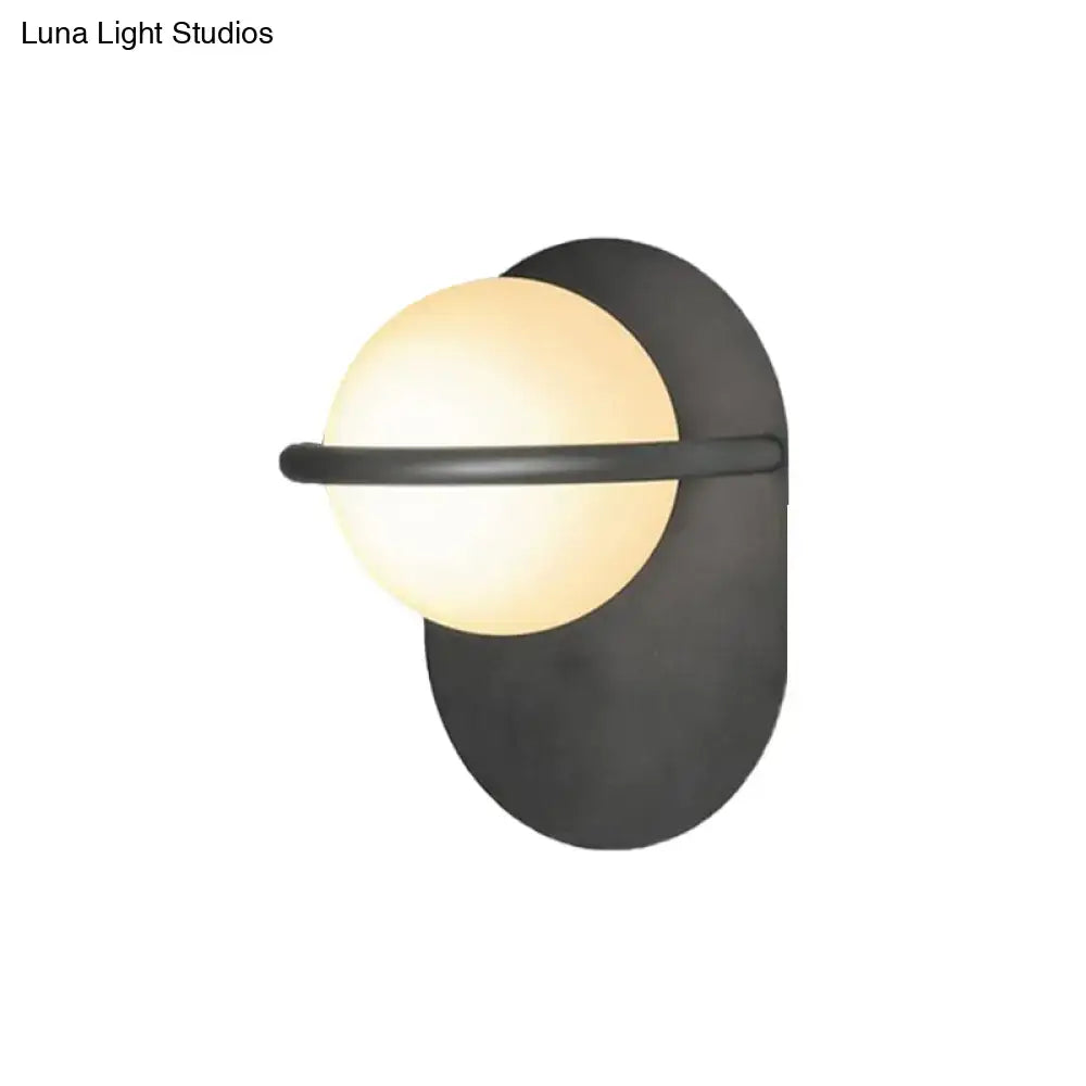 Black Gold Milk Glass Light wall sconce by Decorbites with frosted globe on black backplate on Tampa Home & Garden Store
