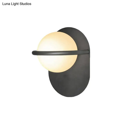 Black Gold Milk Glass Light wall sconce by Decorbites with frosted globe on black backplate on Tampa Home & Garden Store