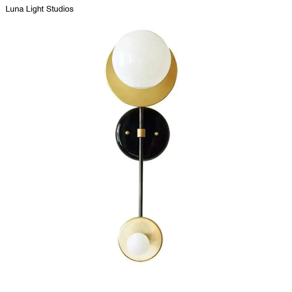 Decorbites black gold glass wall sconce with milky glass globes, two-light on Tampa Home & Garden Store