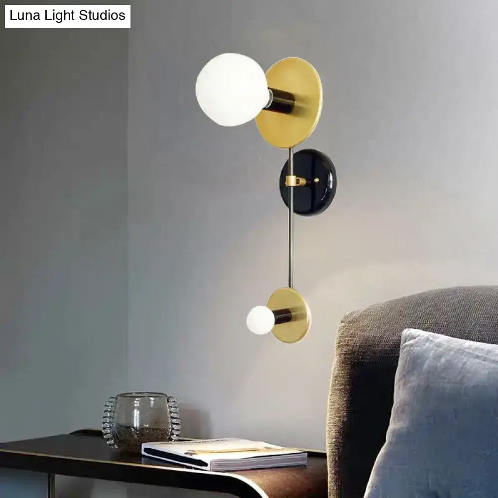 Black Gold Glass Wall Sconce Two-Light with milky globes brass discs black backplate Decorbites on Tampa Home & Garden Store