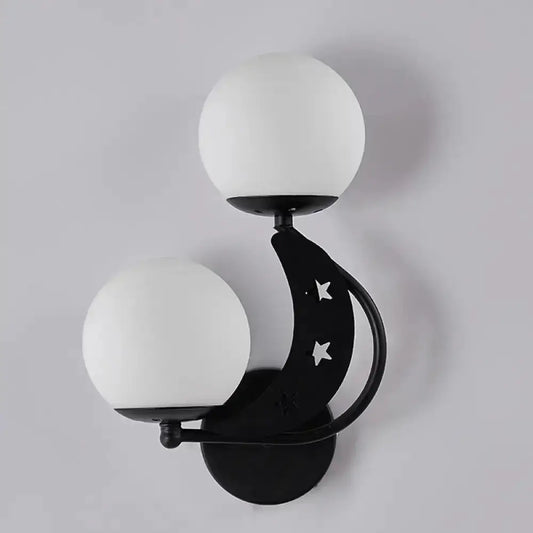 Moon wall lamp by Decorbites black crescent arm with star cutouts and two milky globes on Tampa Home & Garden Store