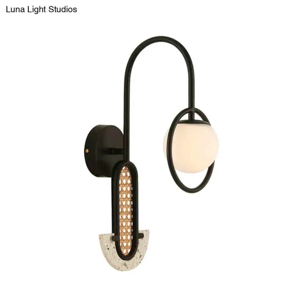 Gold Black Opal Glass Sconce with curved black frame and frosted globe dual light by Decorbites on Tampa Home & Garden Store