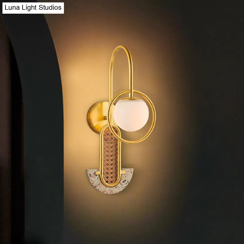 Gold Black Opal Glass Sconce with brass rings and frosted globe, mosaic arc on Tampa Home & Garden Store