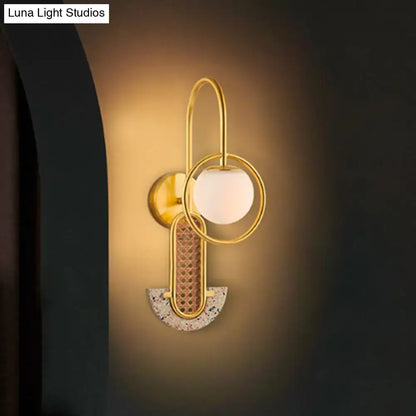 Gold Black Opal Glass Sconce with brass rings and frosted globe, mosaic arc on Tampa Home & Garden Store