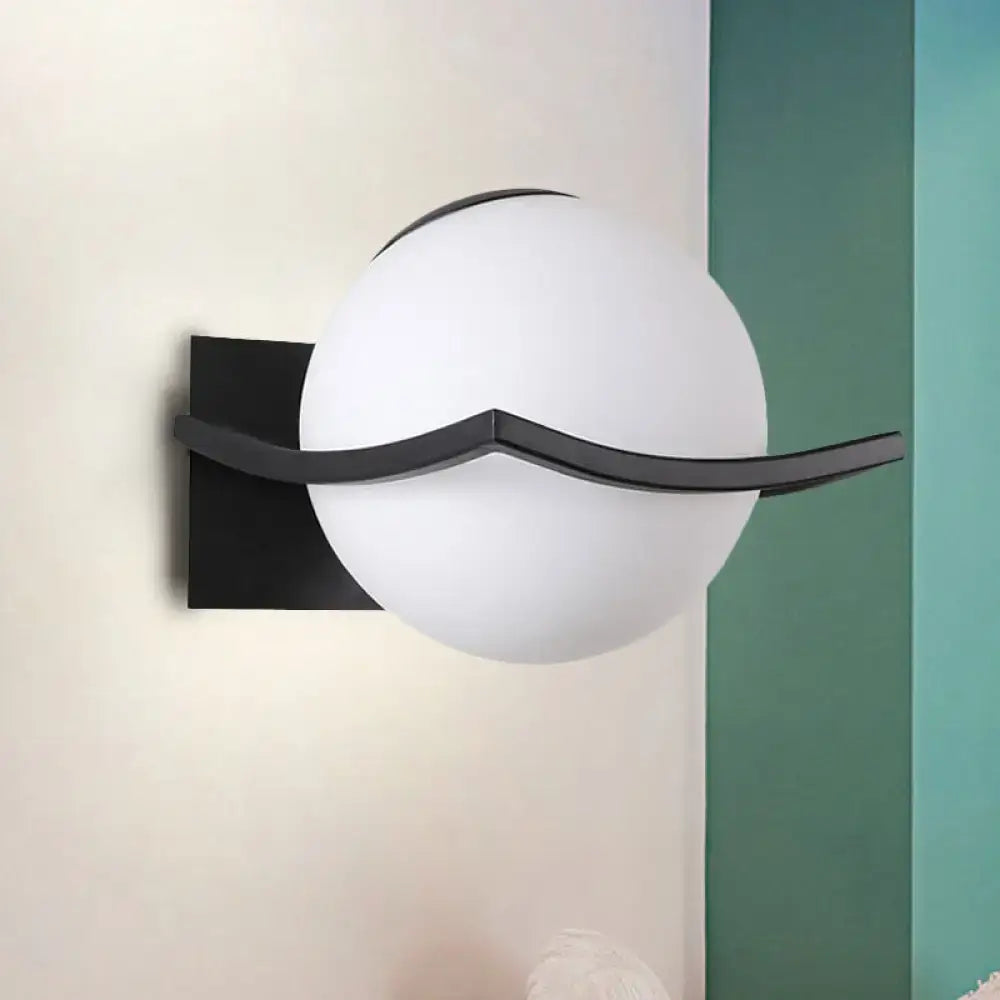 Decorbites Gold Opal Globe Sconce with white opal globe and black curved mounting bar on Tampa Home & Garden Store
