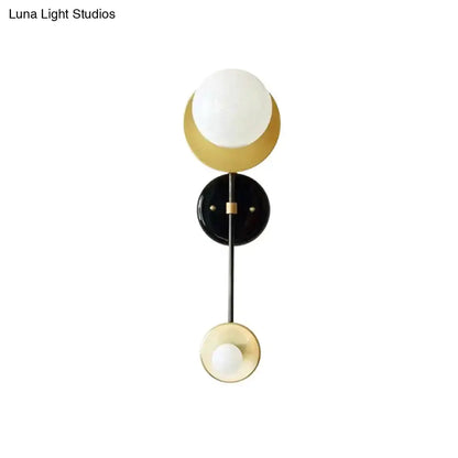 Opal glass wall sconce with black backplate and gold accents by Decorbites on Tampa Home & Garden Store